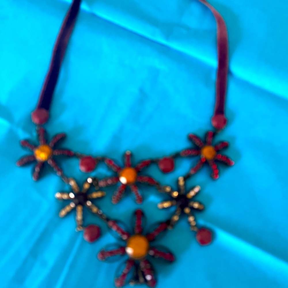 Lovely brown choker featuring flowers with a velvet band
